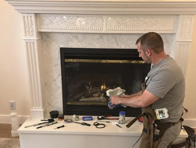 Palm Beach Gardens Chimney Sweep performing fireplace maintenance in Palm Beach Gardens, FL